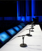 Image of microphones at symposium